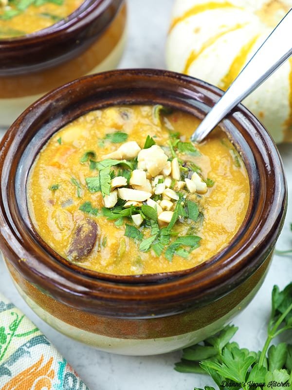 Curried Pumpkin Peanut Soup with spoon