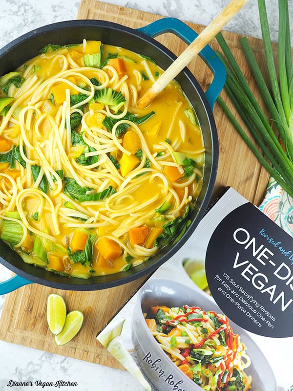 Coconut Curry Noodles and Butternut Squash from One-Dish Vegan in pot with book