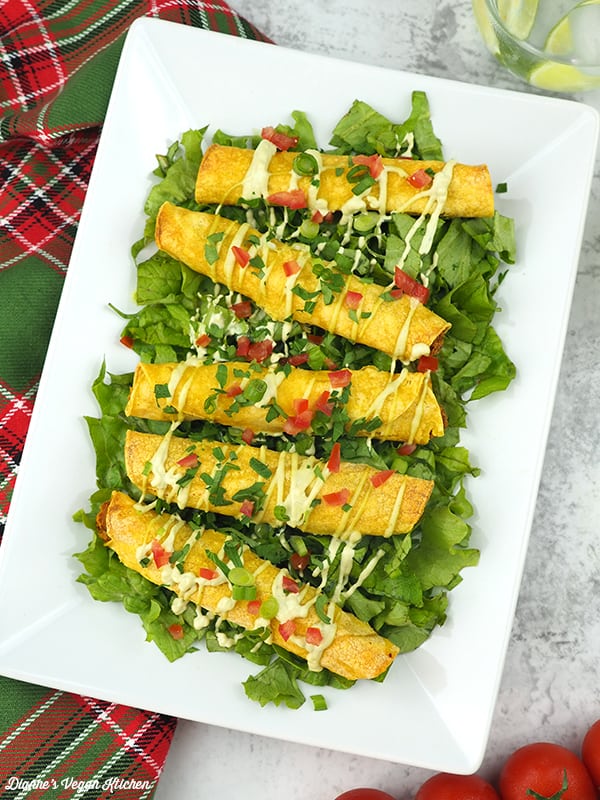 Vegan Taquitos on platter with cashew ranch drizzle