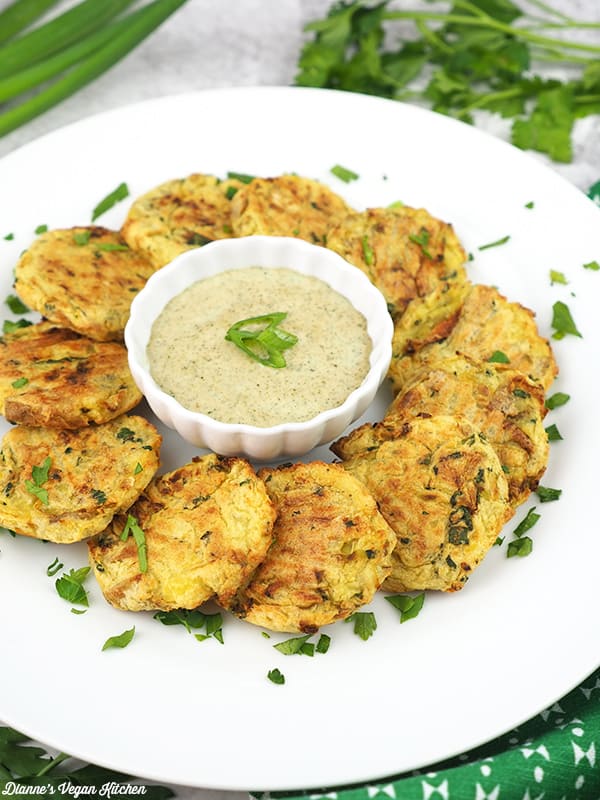 colcannon cakes on plate with dipping sauce