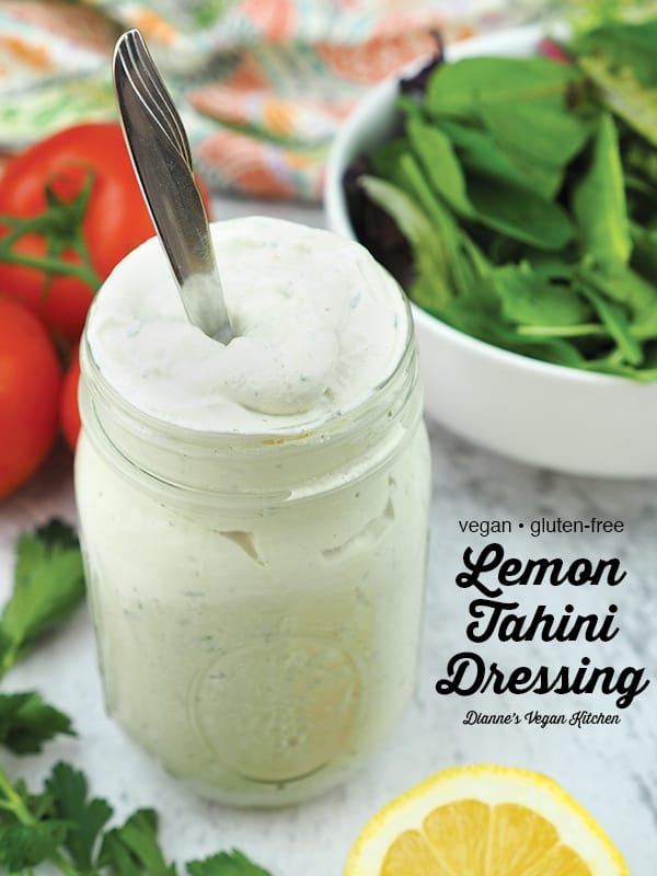 Lemon tahini dressing in jar with text overlay