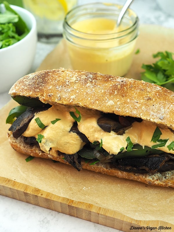 close up of vegan portobello cheesesteak sandwich