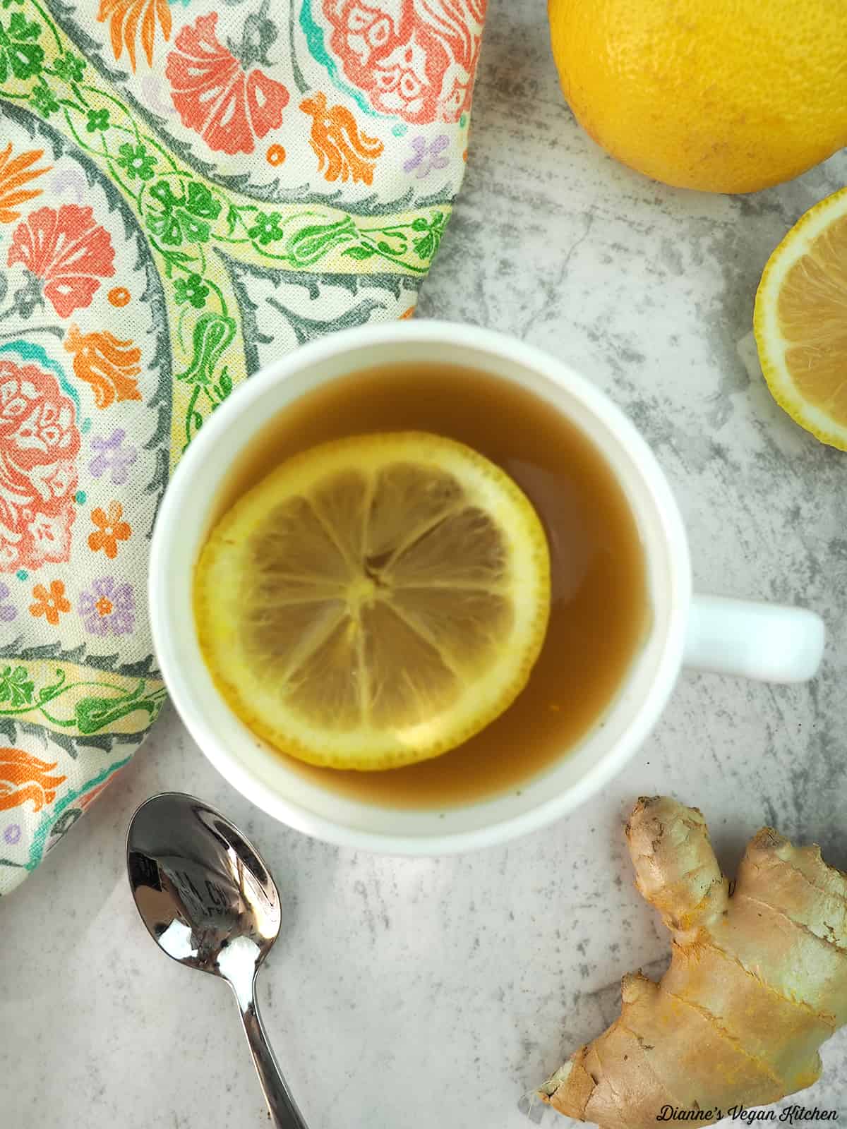 one mug of tea overhead with a slice of lemon in it