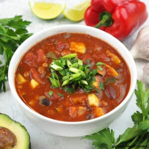 Three Bean Chili with avocado, parsley, lime, and garlic square
