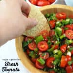 Dipping a chip in salsa with text overlay