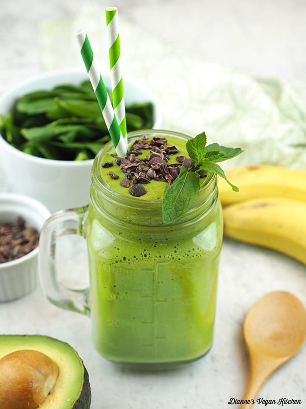 shamrock shake with spinach, banana, nibs, avocado and spoon