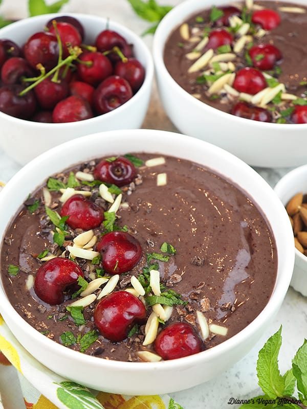 close up of a smoothie bowl with cherries