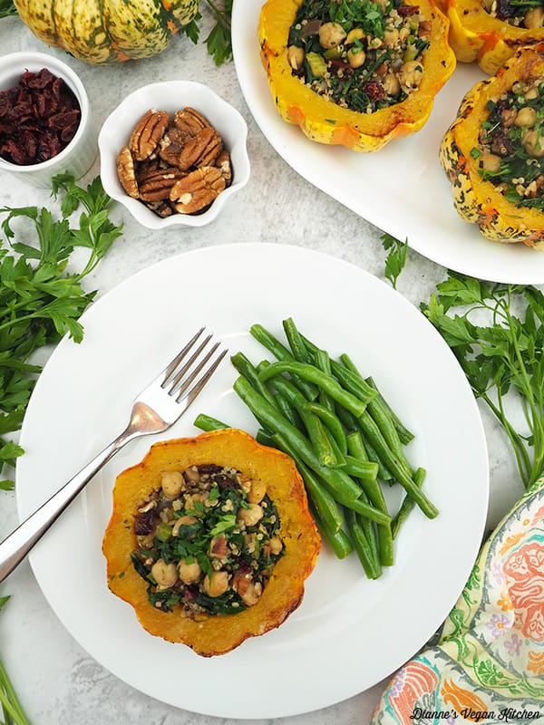 stuffed squash on plate with green beans overhead