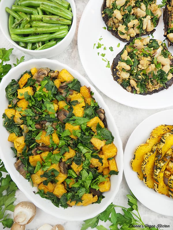 dish of stuffing with stuffed portobellos, squash, and green beans