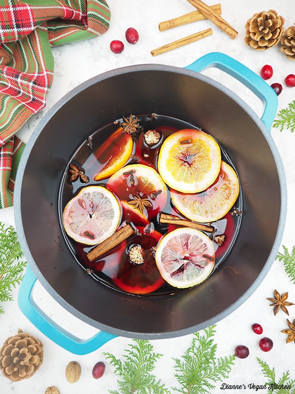 mulled wine in pot with cranberries and spices