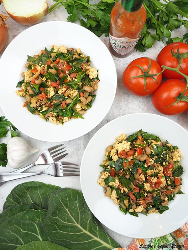 two bowls of of Hoppin’ John Tofu Scramble with collards, onion, hot sauce and tomatoes