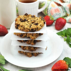 stack of cookies with tea, almond milk, strawberries and mint