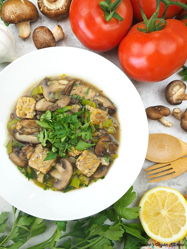 vegan fricassee with tomatoes, mushrooms, and lemon