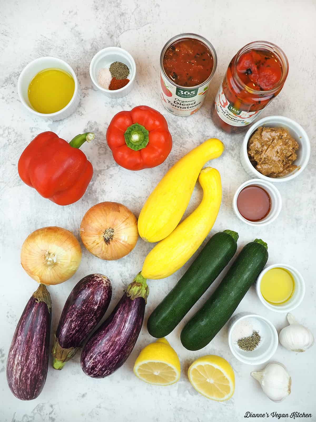 olive oil, spices, roasted tomatoes, roasted red peppers, almond butter, agave, squash, zucchini, onions, eggplant, garlic, salt and pepper, lemons, and bell peppers