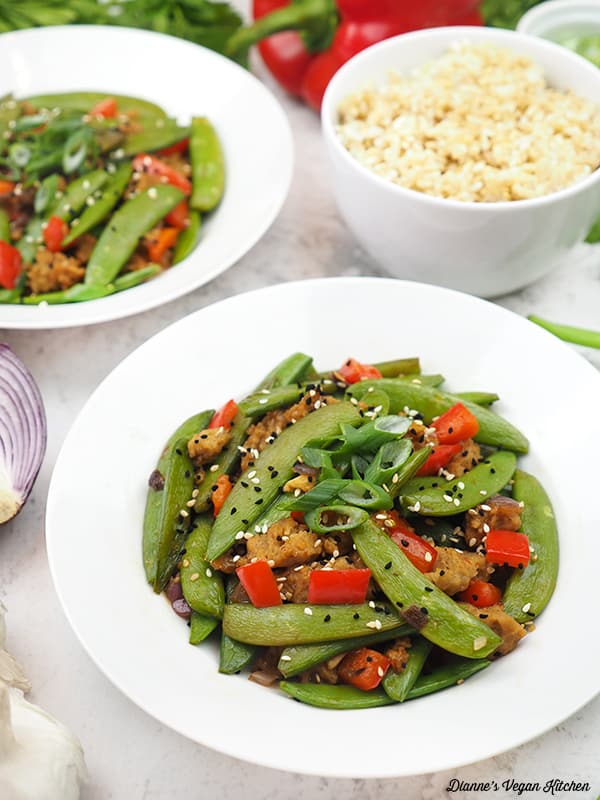 two bowls of Snap Pea Stir Fry with rice