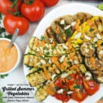 Grilled summer vegetables with easy romesco sauce with text overlay