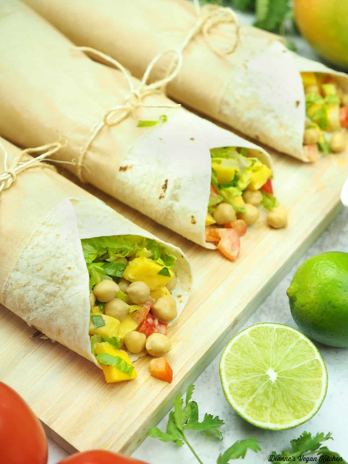 curried mango chickpea wraps with limes and mangos