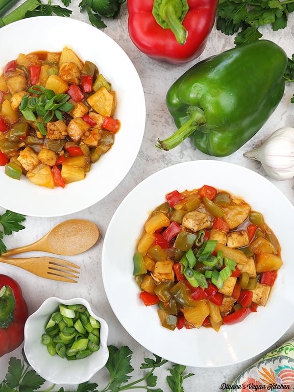 two bowls of sweet and sour for with peppers and scallions