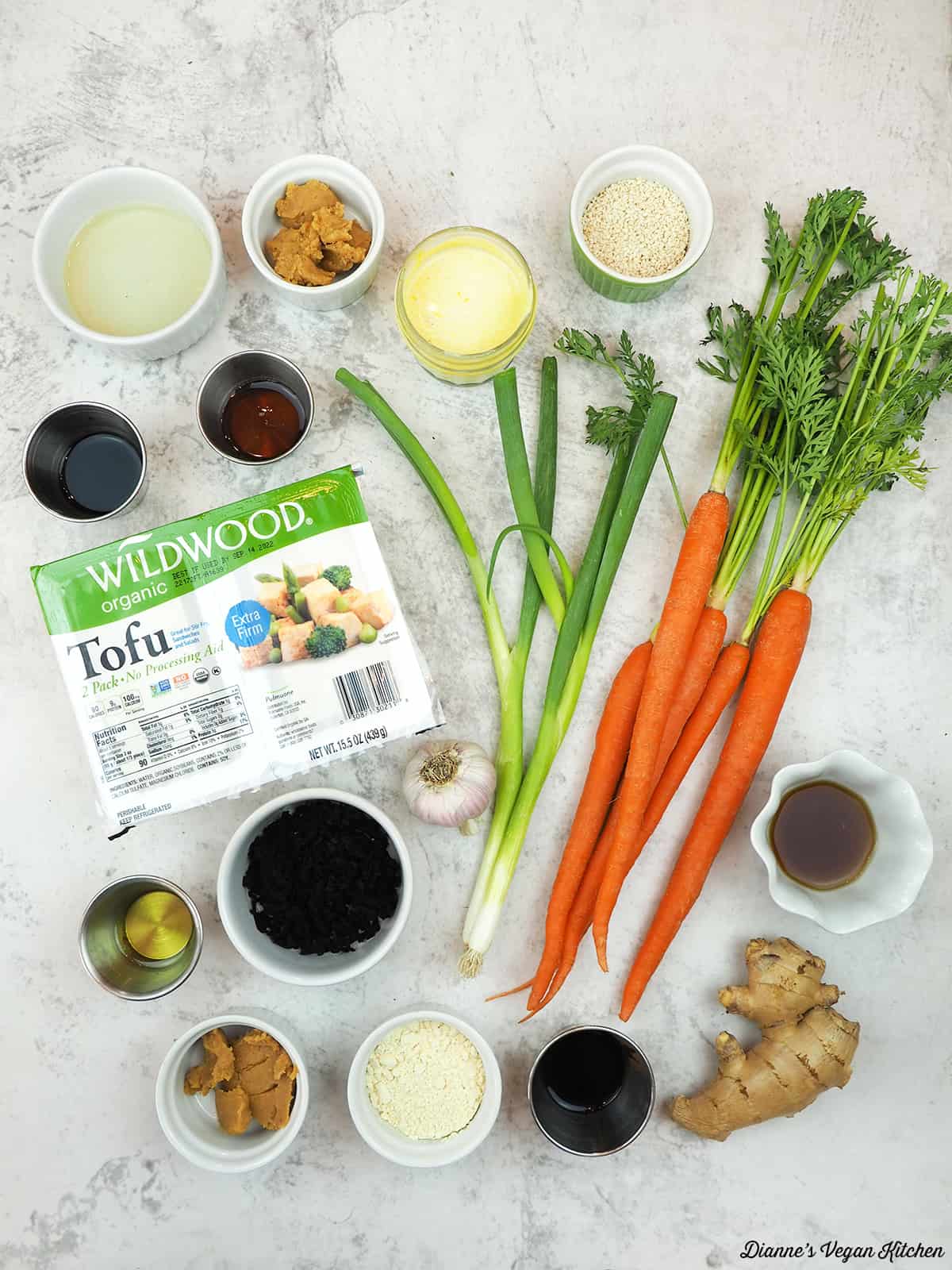 tofu, carrots, ginger, miso, tahini, vinegar, agave, tamari, and ginger, scallions, seaweed, sesame seeds, sesame oil, chickpea flour