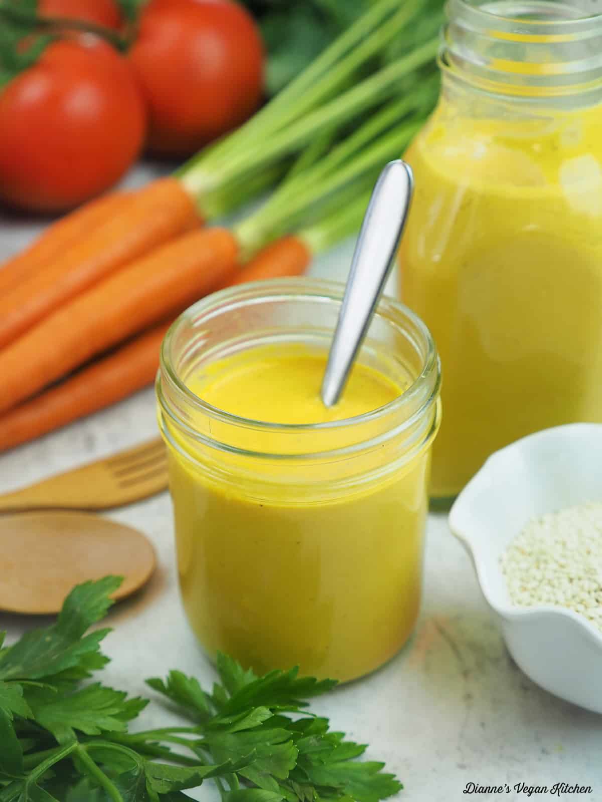 dressing with sesame seeds, carrots, and tomatoes