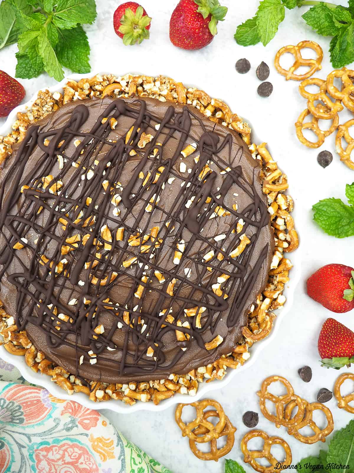 Chocolate Pretzel Pie with mint, strawberries, chocolate chips, and pretzels