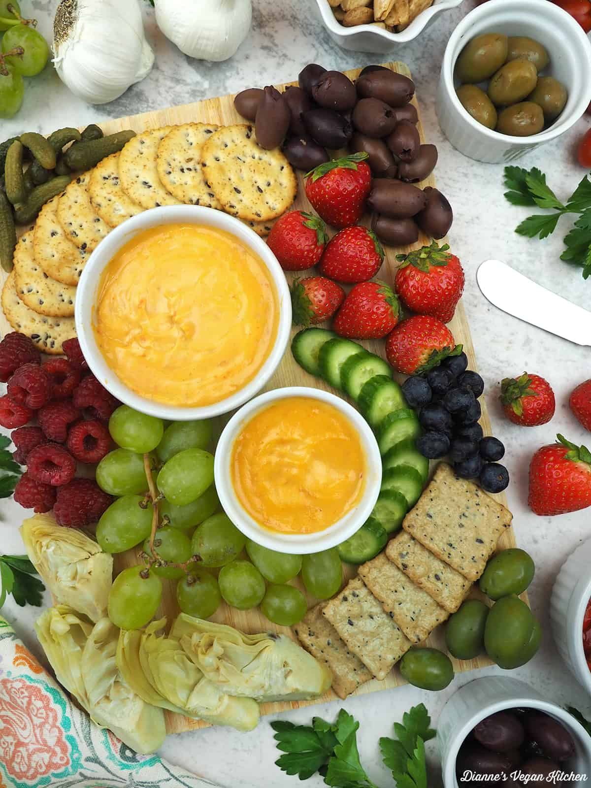Cheese board with Smoked Almond Cheddar, fruit, nuts, and crackers