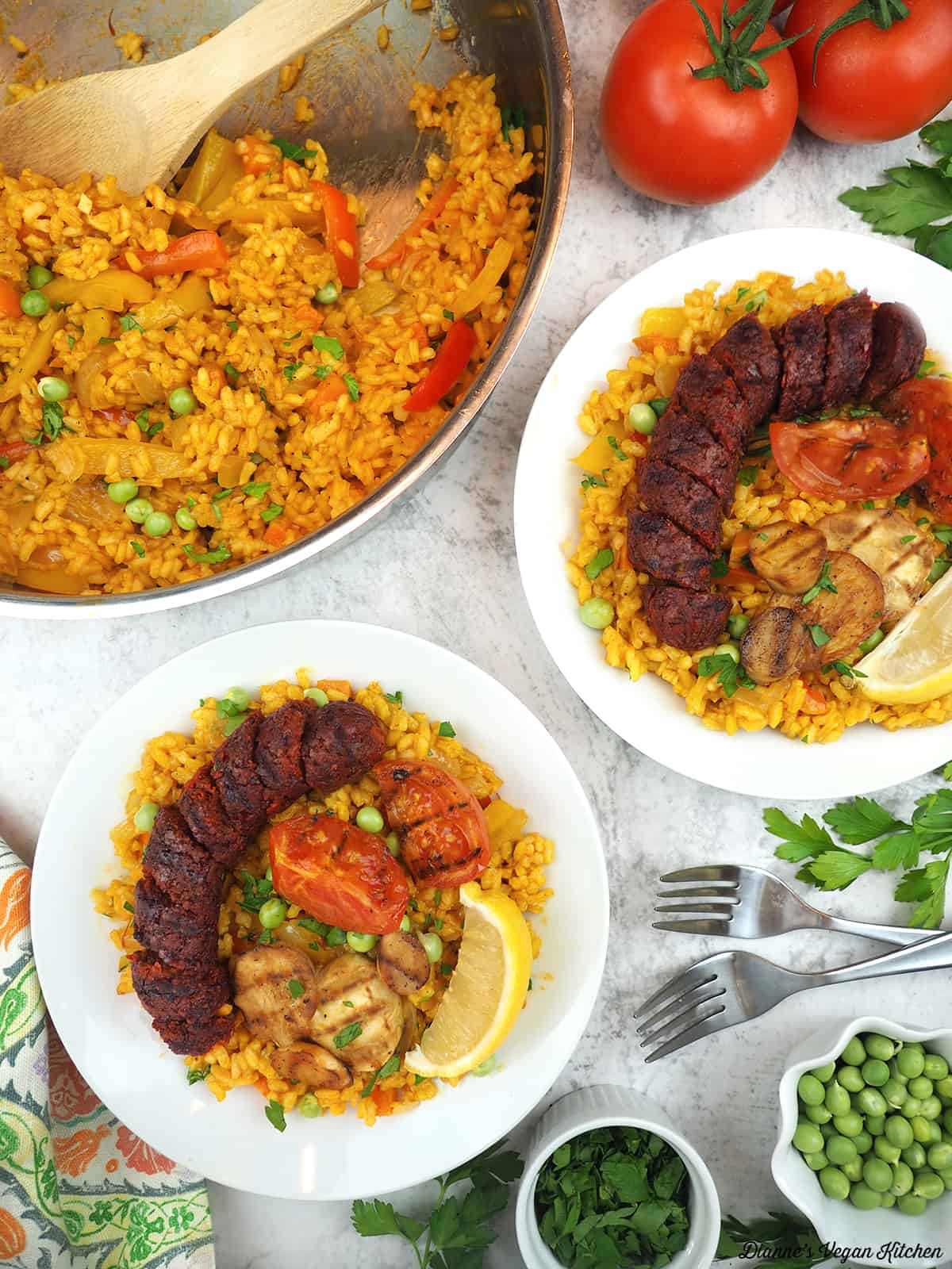 two bowls of paella with paella pan