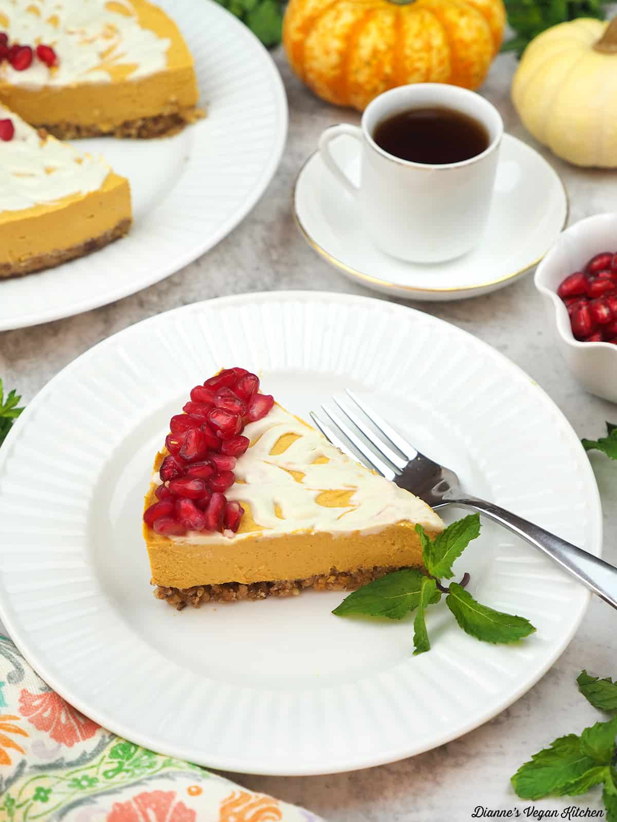 slice of cheesecake with cup of tea