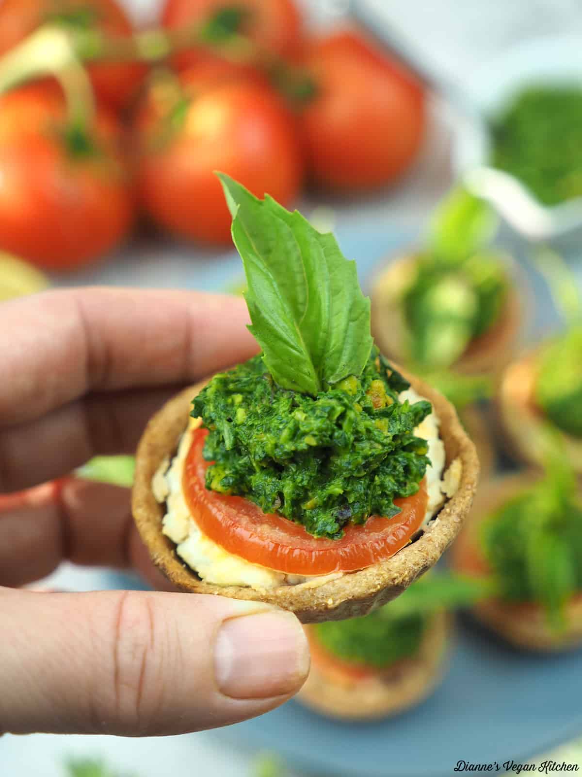 holding a tomato tartlet in my hand