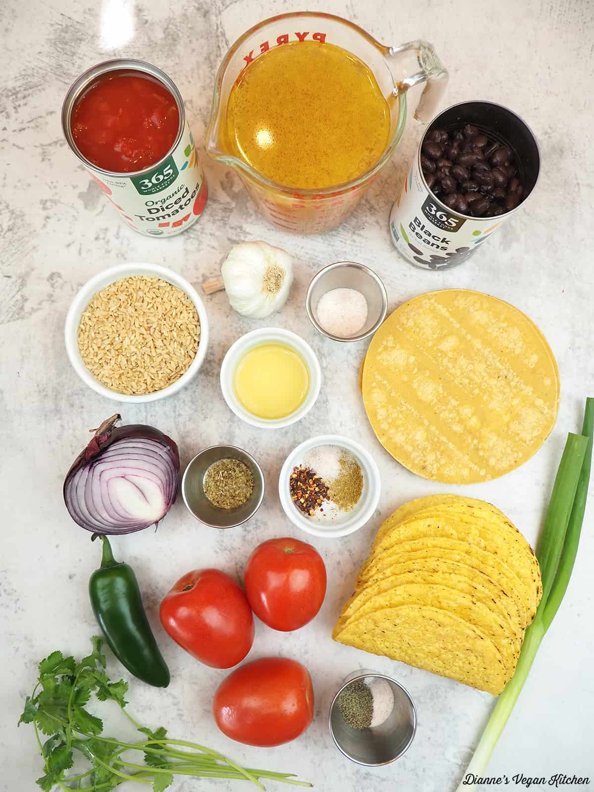 diced tomatoes, vegetable stock, black beans, tortillas, taco shells, onion, garlic, jalapeños, rice, tomatoes, spices, scallion, cilantro