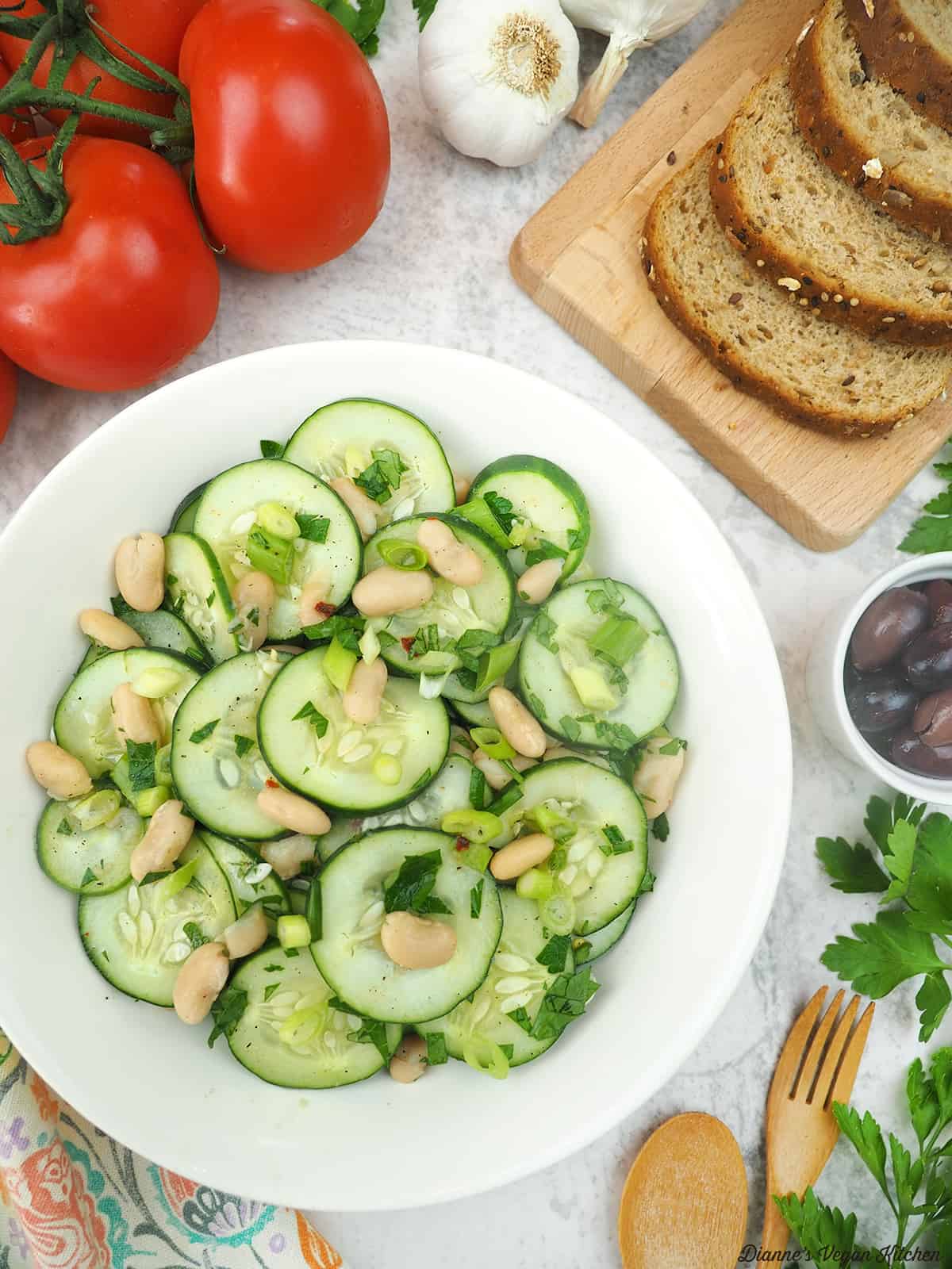 cucumber salad with bread, tomatoes, and olives