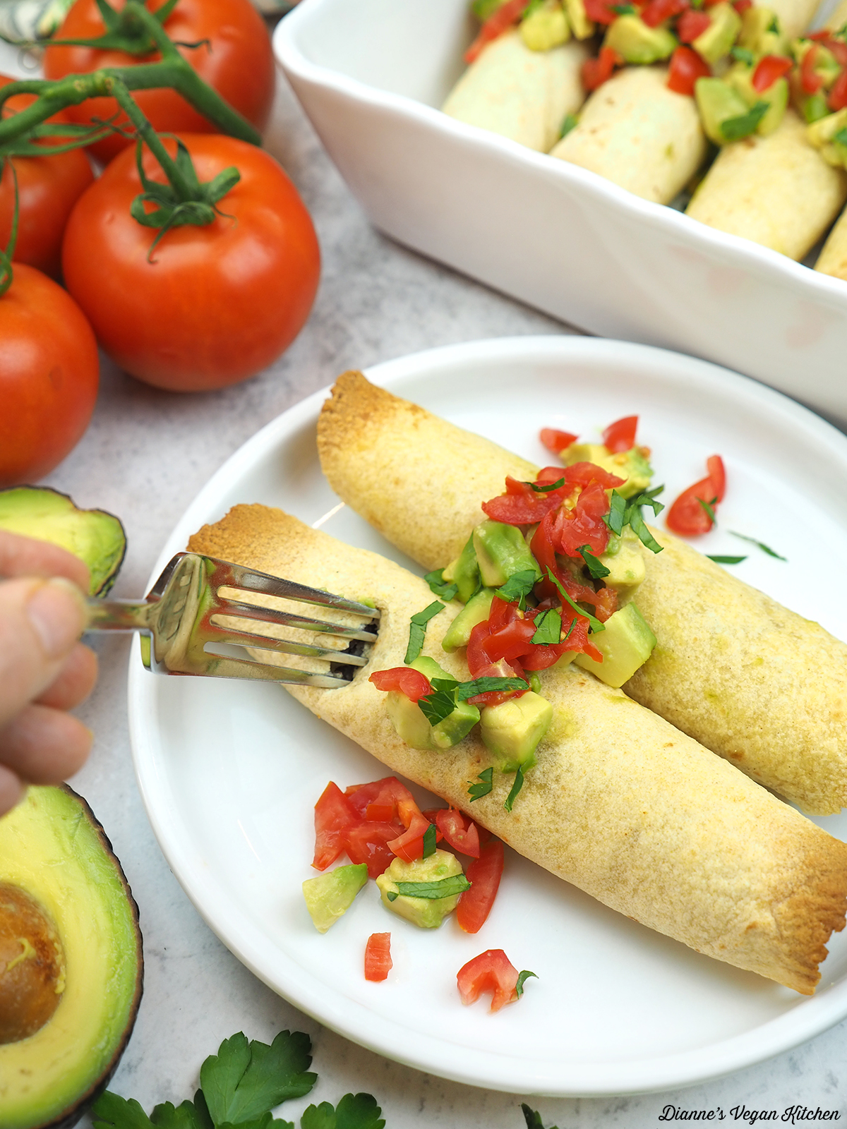 cutting into taquitos with a fork